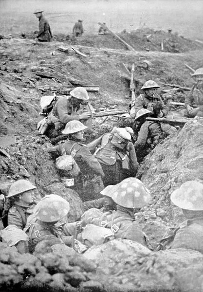 British troops in crude roughly-dug trenches await the signal to attack in the Third
