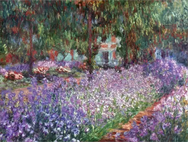 MONET: GIVERNY, 1900. The Artists Garden at Giverny. Oil on canvas by Claude Monet, 1900