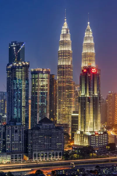 Petronas Twin Towers and city skyline at dusk, Kuala Lumpur, Malaysia