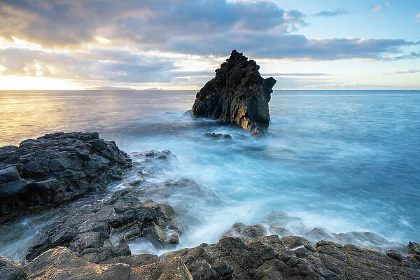 Seascape at rocky coast of Santa Cruz at sunrise Madeira