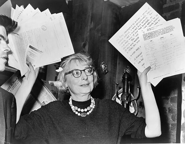 JANE JACOBS (1916-2006). American born Canadian writer and activist. Jacobs at a press conference at the Lions Head Restaurant in Greenwich Village, New York City, 5 December 1961