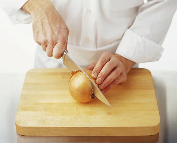 https://www.mediastorehouse.com/p/617/using-chefs-knife-cut-onion-middle-9530145.jpg.webp