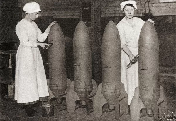 Women putting a coat of paint on aerial bombs during WWI