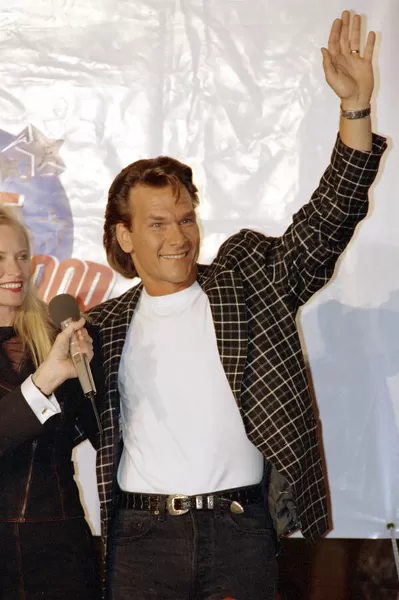 American actor Patrick Swayze arrives for the grand opening of the Planet Hollywood