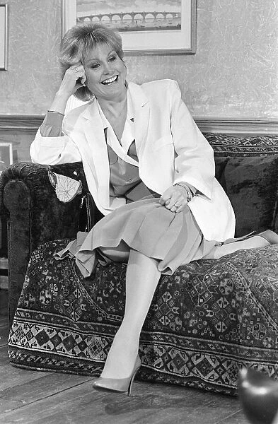 ANGELA RIPPON SMILING SITTING ON A SOFA 15  /  05  /  1986