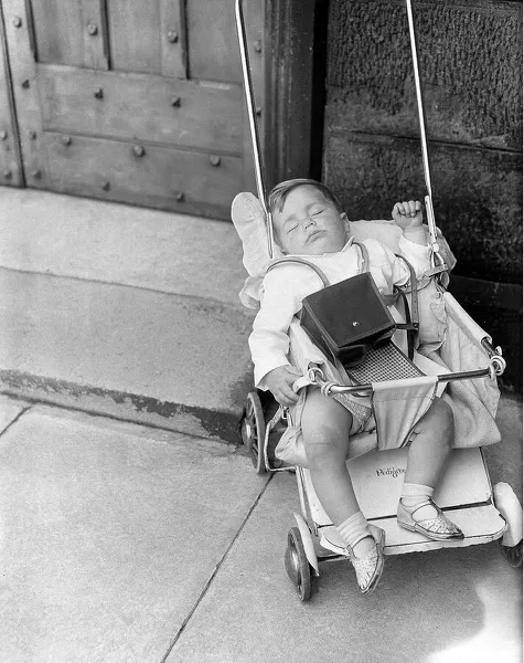 A sleeping child at the Durham Miners Gala in July 1962