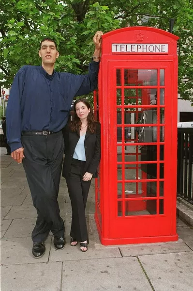 Worlds tallest man Radhouane Charib in London May 1999 at 7ft 9inches with Mirror