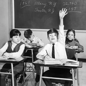 Vintage image of boy raising hand in classroom