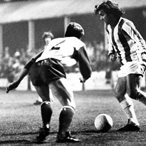 George Best takes on Jim Melrose in a first-half move during the Nuneaton Borough charity