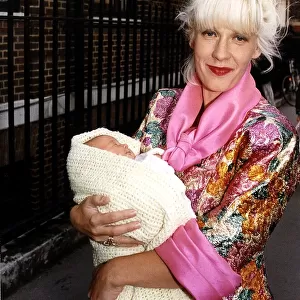 Paula Yates TV Presenter and Model leaving hospital with her new baby daughter