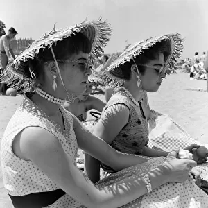 Scenes in Margate during a heatwave. Todays beach fashion, straw hats