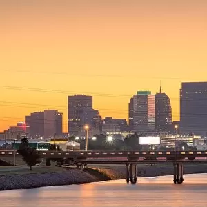 Oklahoma City, Oklahoma, USA downtown skyline on the Oklahoma River at dusk