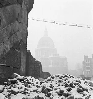 The London Blitz Photo Mug Collection: St Pauls Cathedral in bomb damaged surroundings a093716