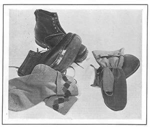 Array Collection: An array of walking boots, knitted socks and waterproof mittens, from Gamages Date: 1930