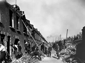 The London Blitz Photographic Print Collection: Blitz in London -- rescue workers in bombed street, WW2