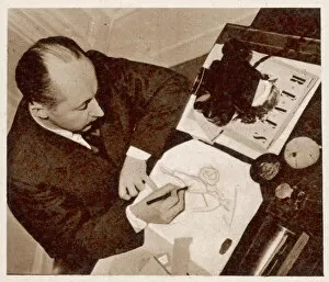 Developed Collection: Christian Dior sketching a fashion design, 1948