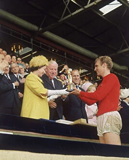 1966 World Cup Framed Print Collection: Queen Elizabeth II presents Bobby Moore with World Cup
