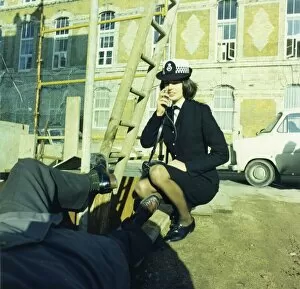 Skirt Collection: Woman police officer attending an accident