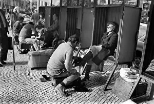 Customers Collection: Woman in shoe shine booth Lisbon