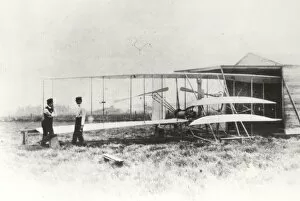 Wilbur Wright Collection: Wilber and Orville Wright with Flyer II at Huffman Prairie