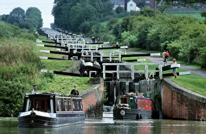 River artworks Pillow Collection: Caen Hill Locks with narrow boats - Wiltshire - UK