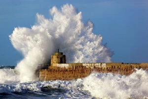 Movement Collection: Portreath - wave breaks over pier in storm - Cornwall - UK