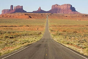 Flat Earth Photo Mug Collection: USA - One of the most famous images of the Monument Valley is the long straight road (US 163)