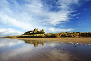 Castles Fine Art Print Collection: England, Northumberland, Bamburgh Castle. Bamburgh Castle and dunes near Bamburgh village
