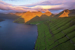 Denmark Pillow Collection: Aerial shot of the dramatic view of Funningur with pink sky at dawn, Eysturoy island