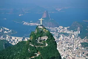 Cityscape Collection: Aerial view of Rio de Janeiro with the Cristo Redentor (Christ the Redeemer) in the foreground