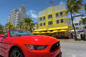 Street photography Framed Print Collection: Art Deco architecture and red sports car on Ocean Drive, South Beach, Miami Beach