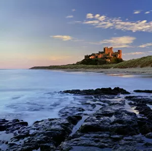 Bamburgh Collection: Bamburgh Castle bathed in warm evening light, Bamburgh, Northumberland