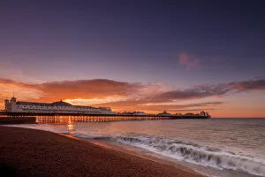 Brighton & Hove Pillow Collection: Brighton Pier and beach at sunrise, Brighton, East Sussex, Sussex, England, United Kingdom