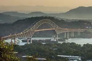 Panama City Collection: Cargo boat passes the Bridge of the Americas on the Panama Canal, Panama City, Panama