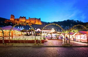 German Culture Collection: Christmas Market at Karlsplatz in the old town of Heidelberg, with Castle Heidelberg, Heidelberg