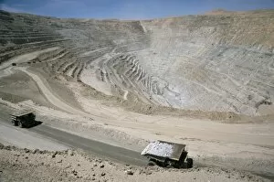 Hole Collection: Chuqui open-pit copper mine, 4km long, 720m d eep, trucks each carrying 300t of ore