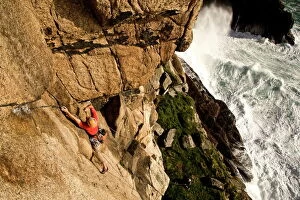Weekend Activities Collection: A climber on the classic extreme route Raven Wall on the cliffs at Bosigran, near St