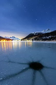 Spiral Galaxy Collection: Cracked ice on the frozen surface of Lake Champfer in winter, Silvaplana, Engadine