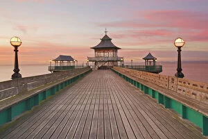 Jetty Collection: A dusk view of Clevedon Pier, in Clevedon, on the Bristol Channel coast of Somerset