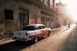 Parked Collection: Early morning street scene with classic American car, Havana, Cuba, West Indies