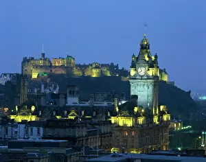 Hotels Collection: Edinburgh Castle and the Waverley Hotel clock tower illuminated at dusk