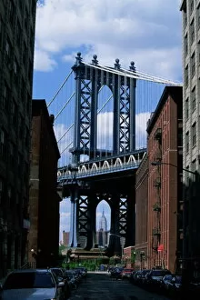 Brooklyn Bridge Photo Mug Collection: Empire State Building in distance seen through Manhattan Bridge