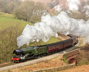 Centuries-old festivities Collection: The Flying Scotsman arriving at Goathland station on the North Yorkshire Moors Railway