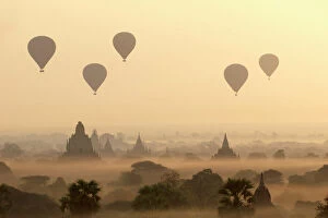 Bagan Collection: Hot air ballons fly over ancient temples at dawn in Bagan (Pagan), Myanmar (Burma), Asia