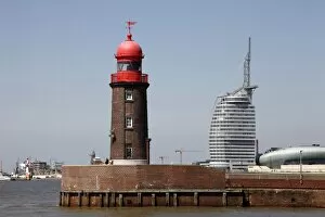 Bremen Collection: Lighthouse at old harbour, and Atlantic Hotel Sail City, Bremerhaven, Bremen
