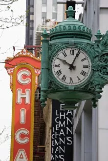 Signs Jigsaw Puzzle Collection: The Marshall Field Building Clock and Chicago Theatre behind, Chicago, Illinois