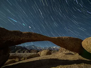 Spiral Galaxy Collection: A naturally formed arch at night in the Alabama Hills National Scenic Area
