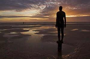 Sculpture Pillow Collection: Another Place statues by artist Antony Gormley on Crosby beach, Merseyside