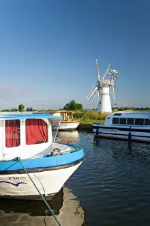 Recreational Boats Collection: Pleasure boats moored beside Thurne windmill, Norfolk Broads, Thurne, Norfolk