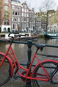 Related Images Poster Print Collection: Red bicycle by the Herengracht canal, Amsterdam, Netherlands, Europe